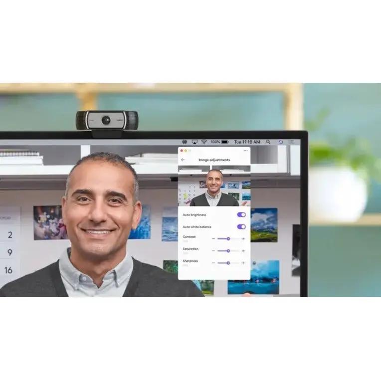 Logitech C930e business webcam, silver/black, mounted on top of a computer monitor