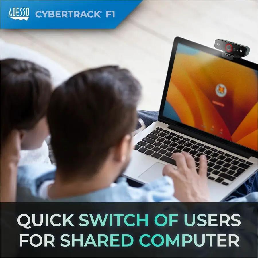 Adesso CyberTrack F1 webcam on a laptop display in a shared computer setup.