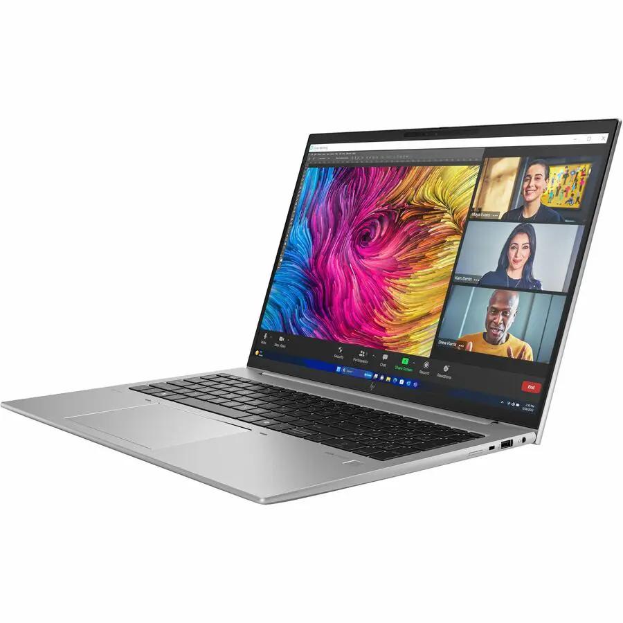 HP ZBook Firefly G11 laptop, silver, 16 GB RAM, 512 GB SSD, open with video conferencing on screen.