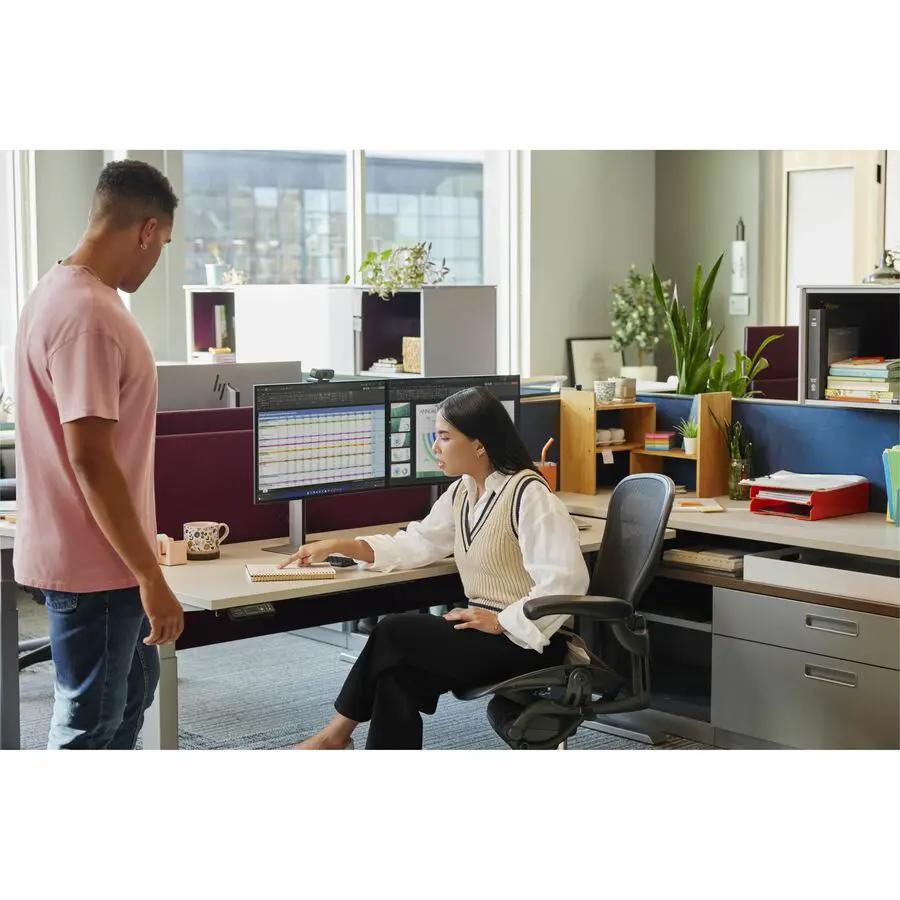 HP 724pn 24-inch WUXGA LCD monitor, black frame, dual displays on an office desk