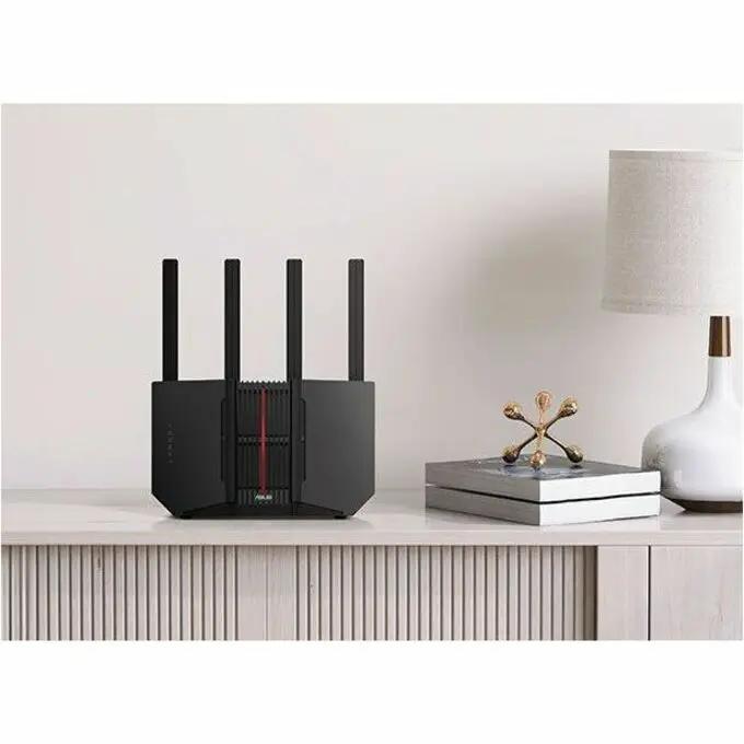 ASUS RT-BE92U Gigabit WiFi 7 TriBand AI Mesh VPN router, black with four external antennas on a light-colored console table.