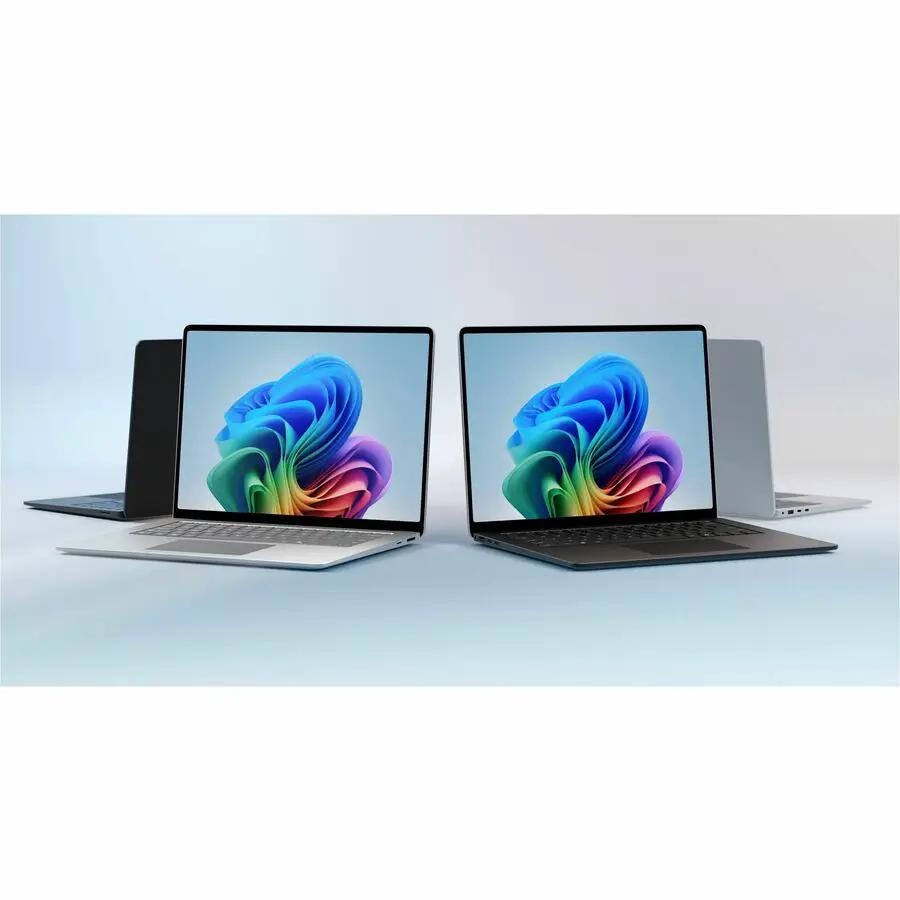 Microsoft Surface Laptop 7 notebook, two units in silver and black, open with colorful screens