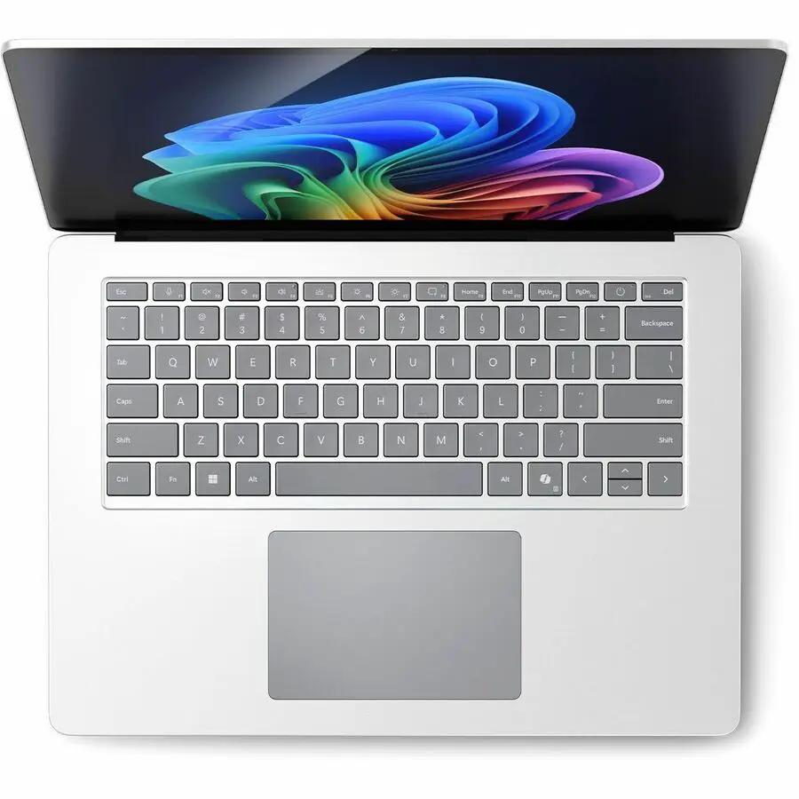 Microsoft Surface Laptop 7, platinum color, top-down view of keyboard and trackpad on white background.