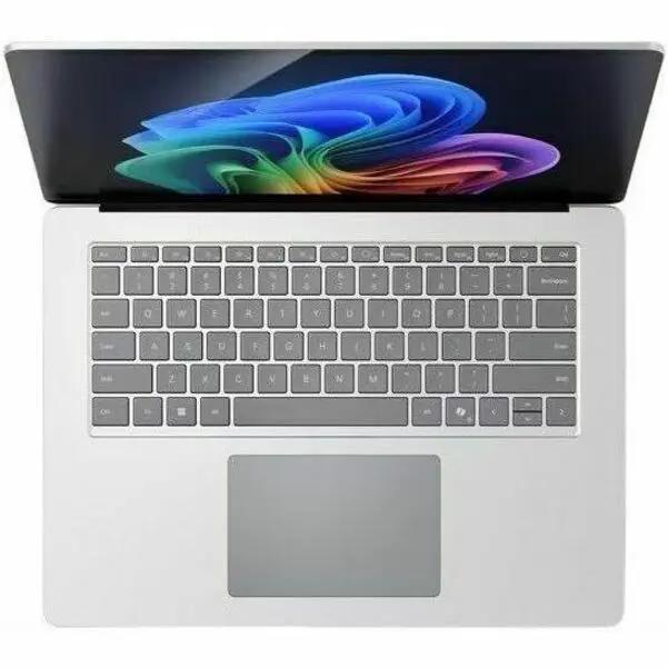 Microsoft Surface Laptop 7 in silver, top-down view showing keyboard and colorful display