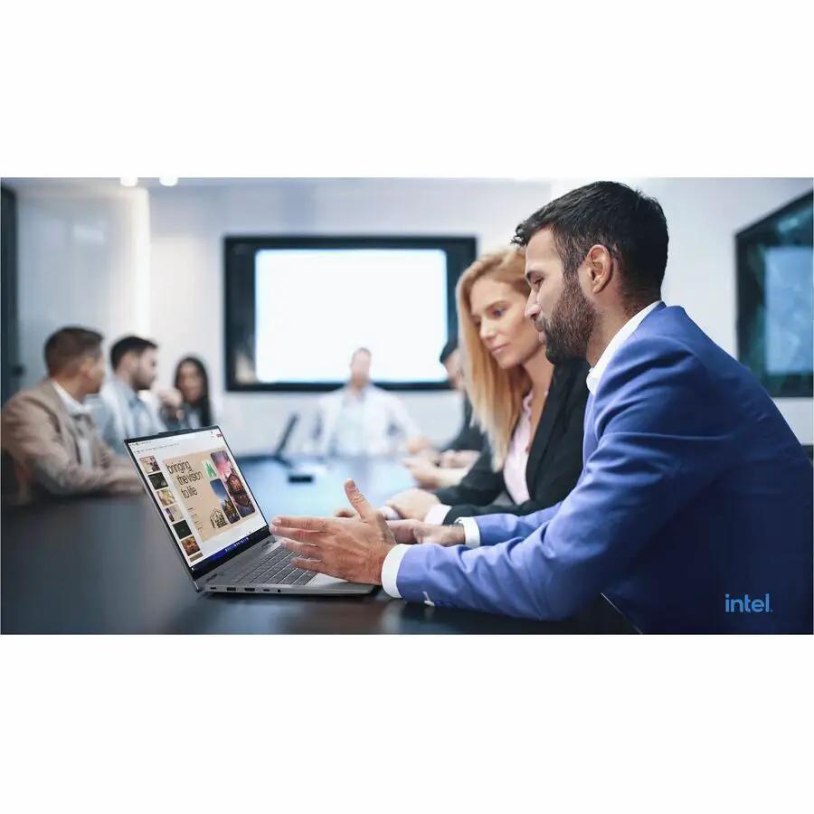 Lenovo ThinkBook 14 G5 2-in-1 laptop in Luna Gray on conference table; Intel logo