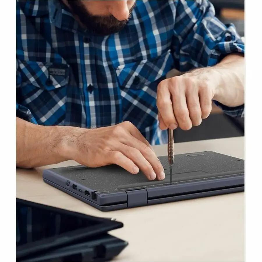 ASUS BR1204F rugged 2-in-1 notebook on desk, mineral gray, being worked on with a screwdriver