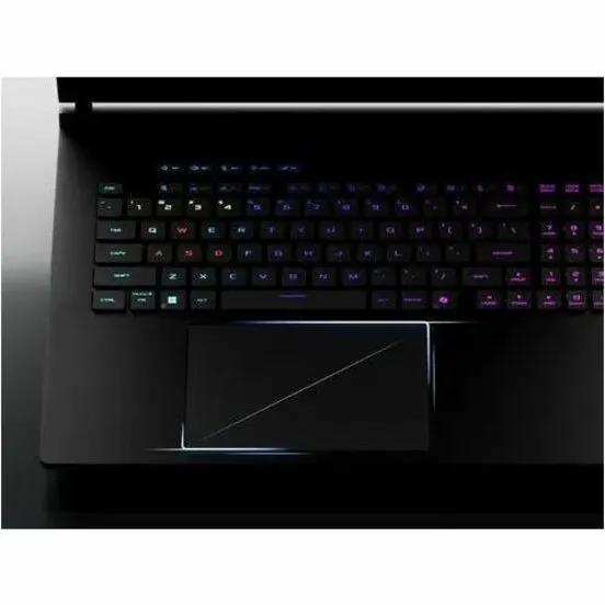 ASUS ROG Strix Scar 18 gaming laptop, top-down view with RGB-backlit keyboard and large touchpad.