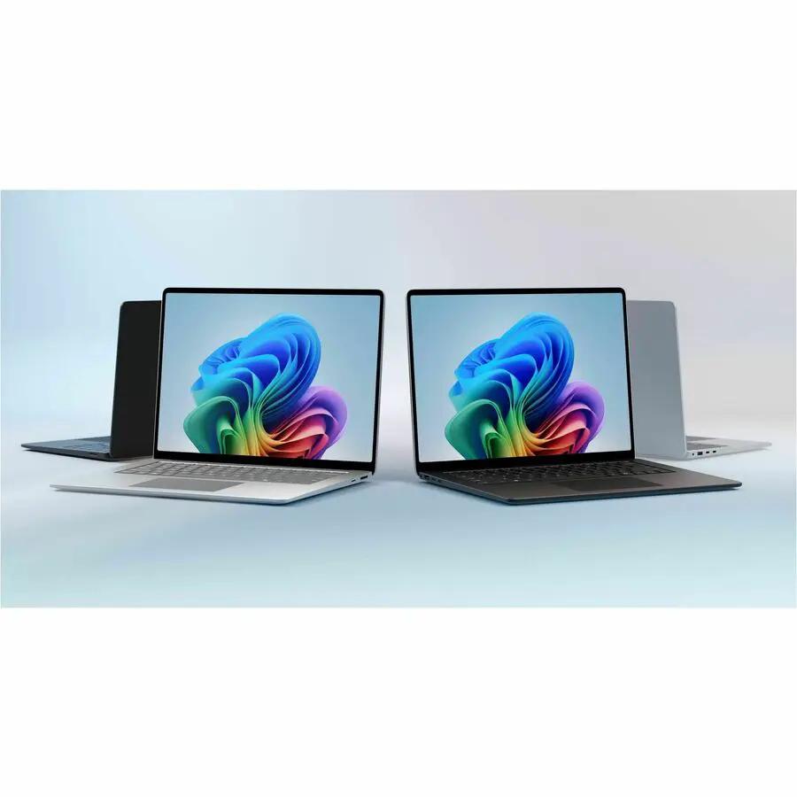 Two Microsoft Surface Laptop 7 laptops open with colorful wallpaper on screens; silver and black finishes.