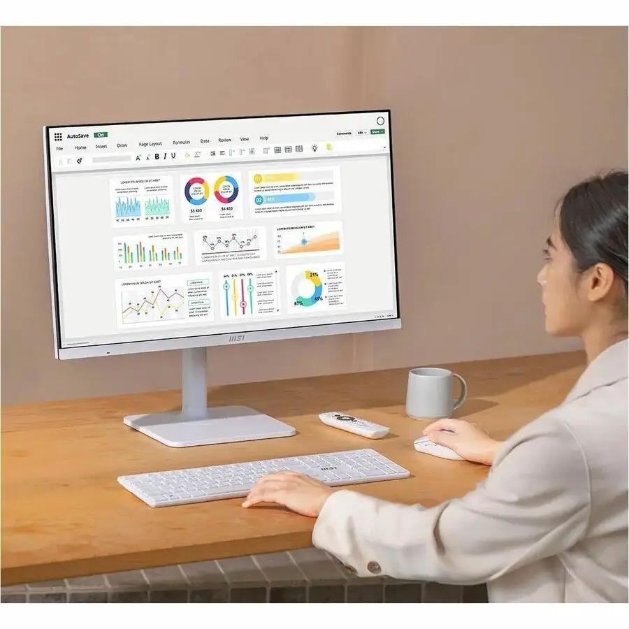 MSI Modern MD272UPSW 27-inch UHD monitor on a white desk with keyboard and mouse