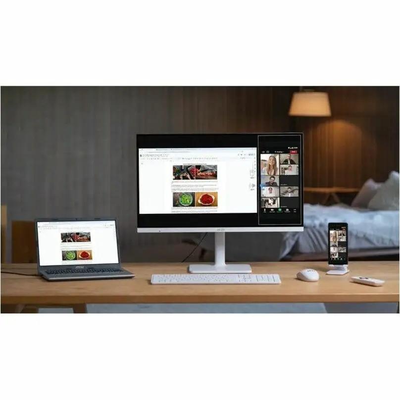 MSI Modern MD272UPSW 27-inch UHD monitor on desk with laptop and smartphone
