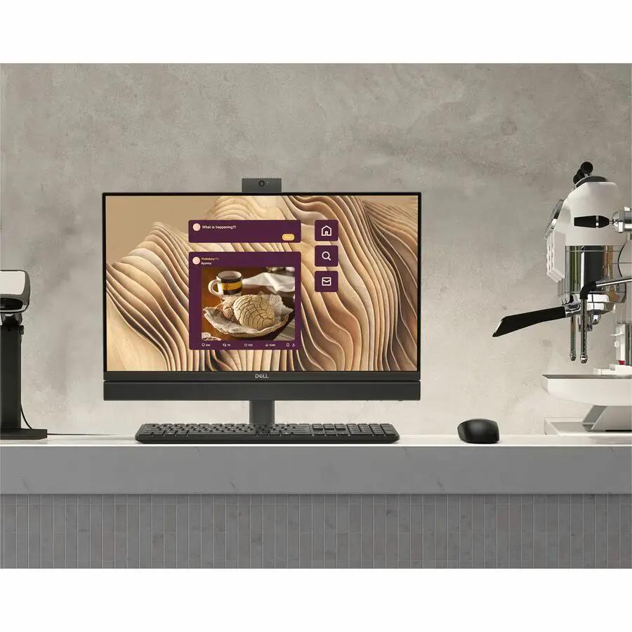 Dell QC24251 Pro 24 All-In-One desktop computer with webcam on desk beside keyboard and mouse.