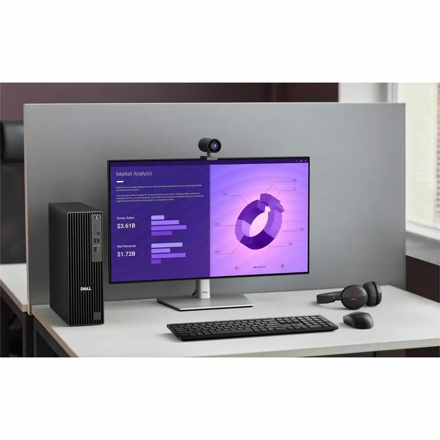 Dell Pro Slim Plus QBS1250 Desktop setup: black tower, monitor, keyboard, mouse, webcam on desk