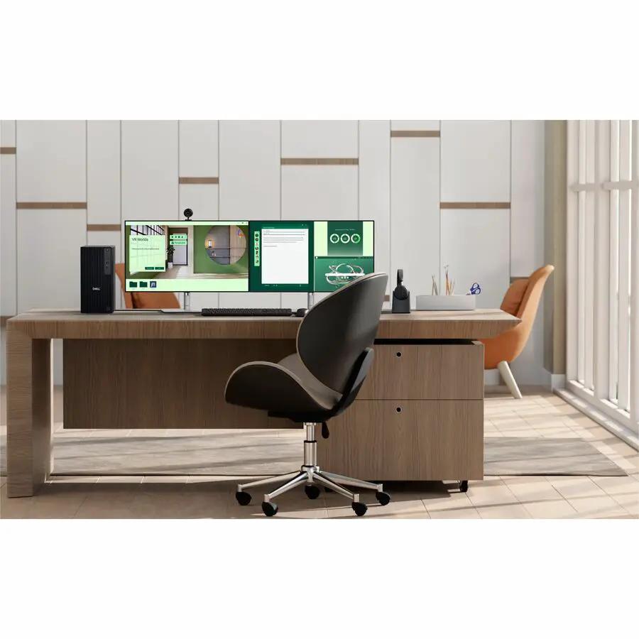 Dell QBT1250 Pro Tower Plus PC on a wooden desk with a black tower and a triple-monitor setup