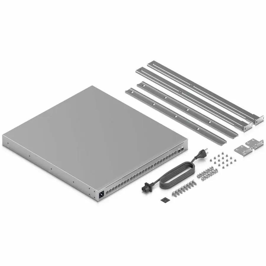Ubiquiti Pro XG 24-Port PoE switch with rack-mount rails and mounting hardware.