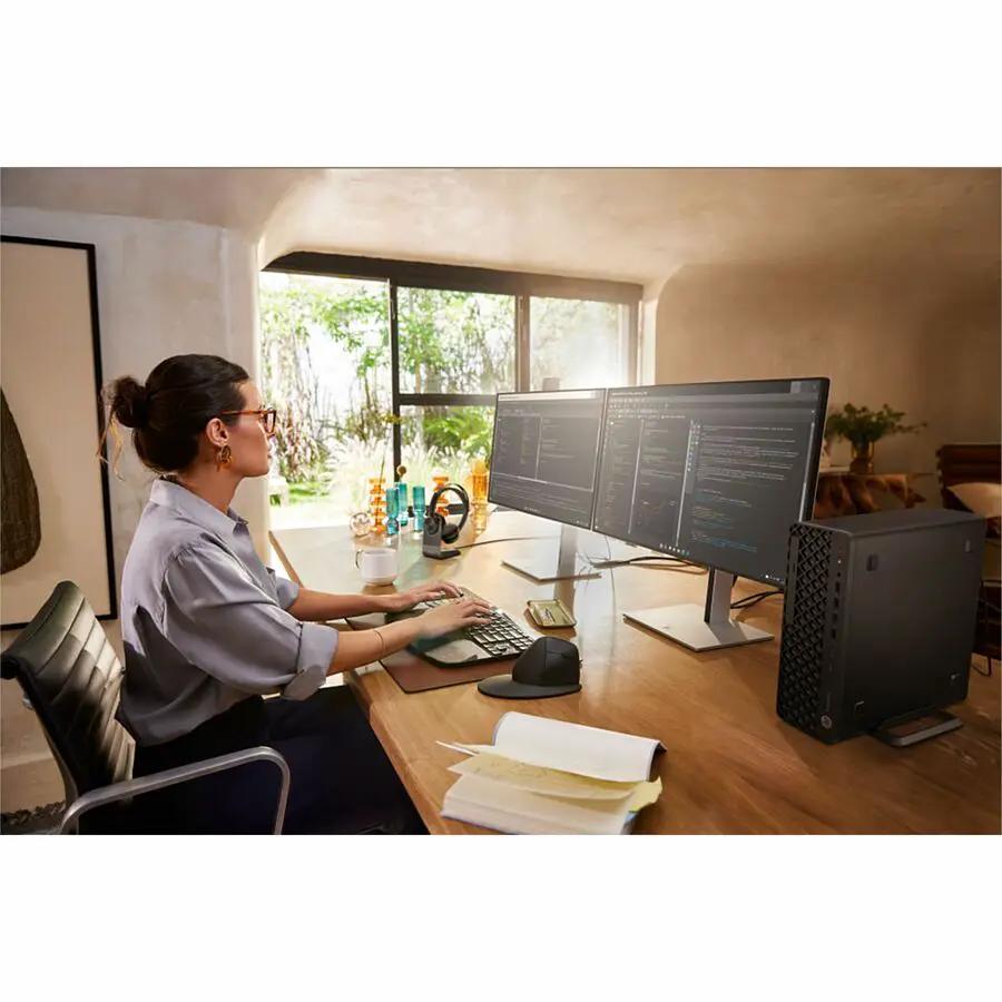 HP EliteDesk 8 SFF desktop PC, black compact computer on a wooden desk with dual monitors.
