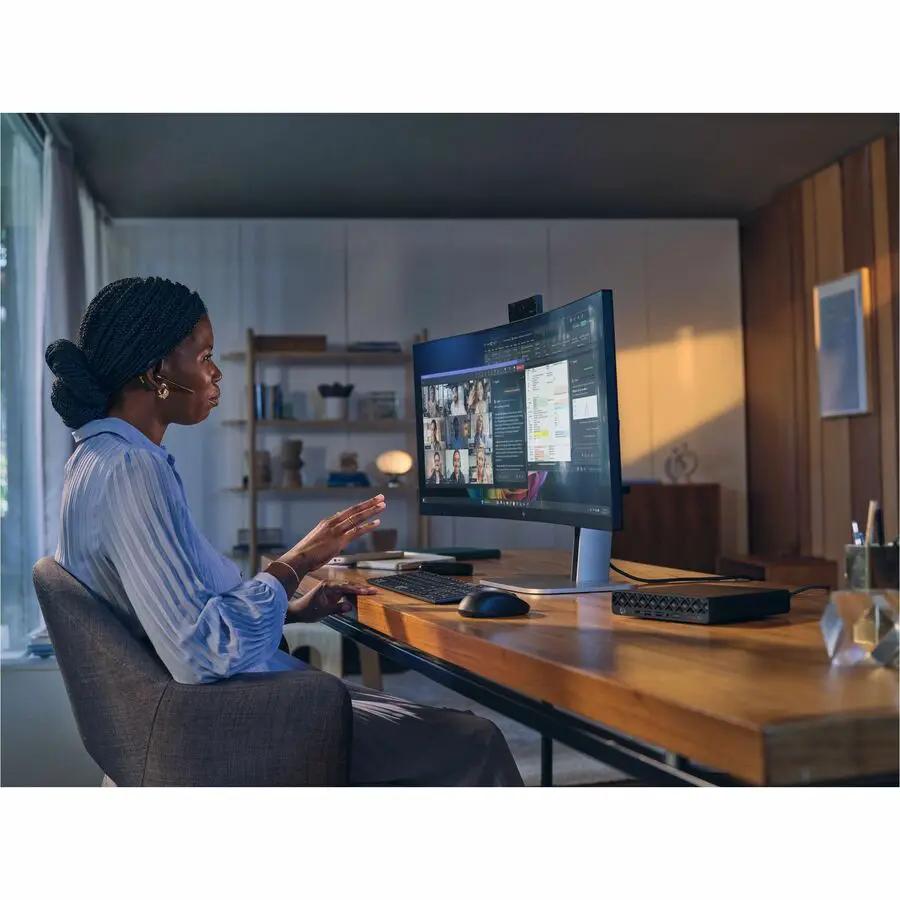 HP EliteDesk G1a Mini Desktop black on a wooden desk with monitor, keyboard, and mouse in a home office.