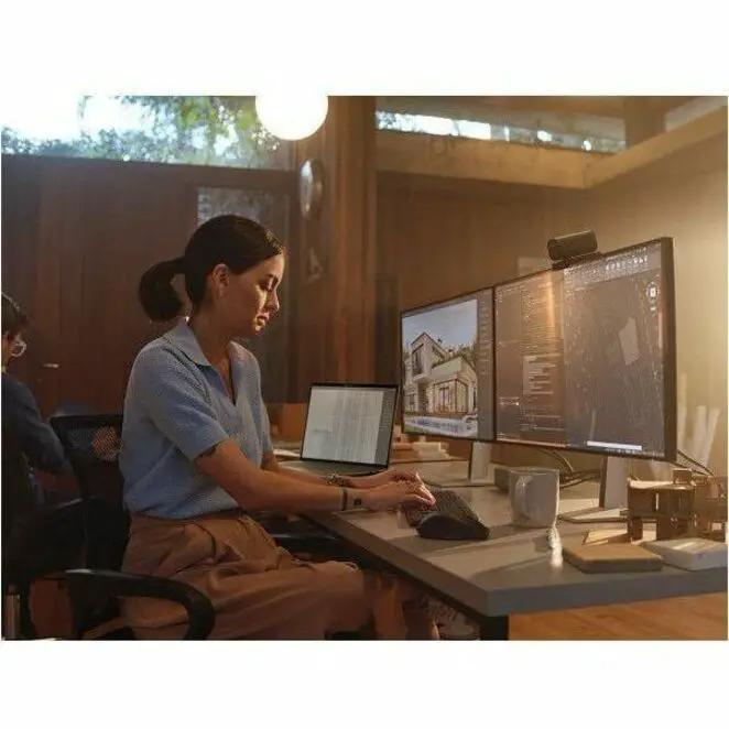 HP ZBook X 16 mobile workstation laptop with dual monitors on a gray desk setup