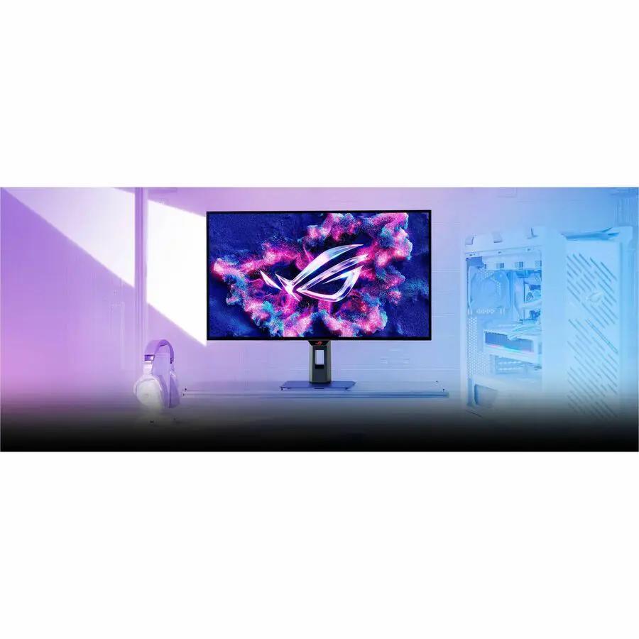 ASUS ROG Strix XG32UCWMG 32-inch 4K OLED gaming monitor on a desk with a PC tower in the background