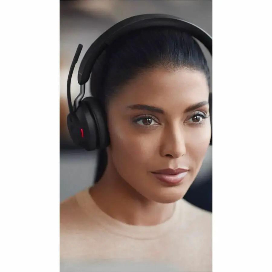 Jabra Evolve2 65 USB MS Mono headset, black, worn by a woman