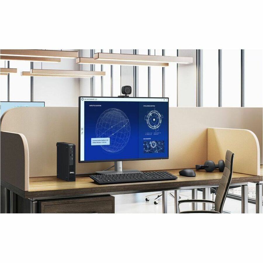 Computer setup on a desk with a monitor, keyboard, and mouse in an office setting.