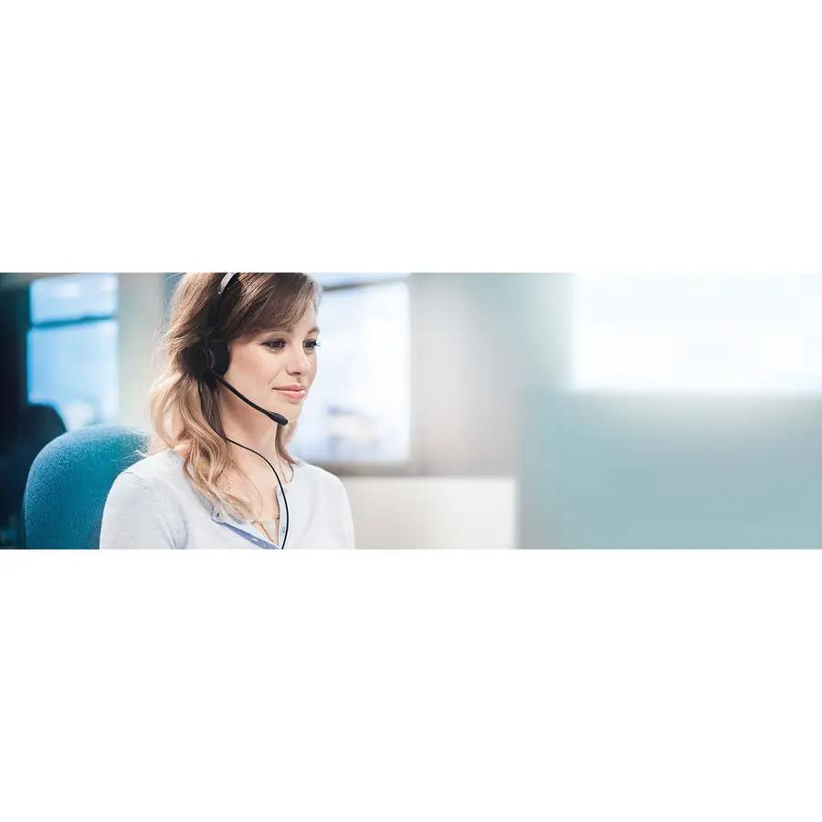 Jabra BIZ 2300 QD Duo NC headset, black, worn by a woman in an office.