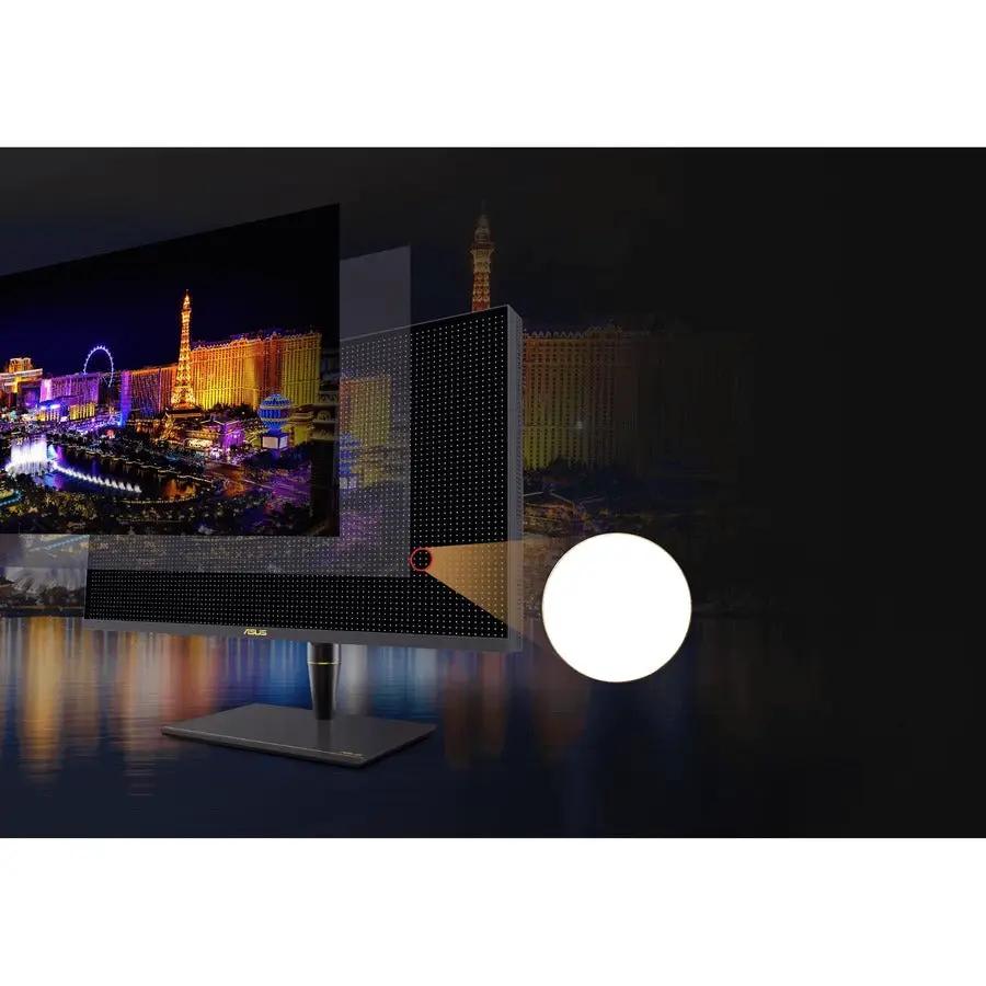 ASUS ProArt PA32UCX-PK 32-inch 4K UHD IPS Mini LED Monitor on a stand, displaying a cityscape image with a white globe lamp nearby.