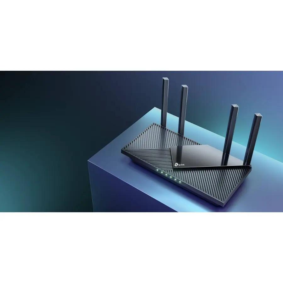 TP-Link Archer AX55 Gigabit WiFi 6 router with four external antennas on a blue pedestal.