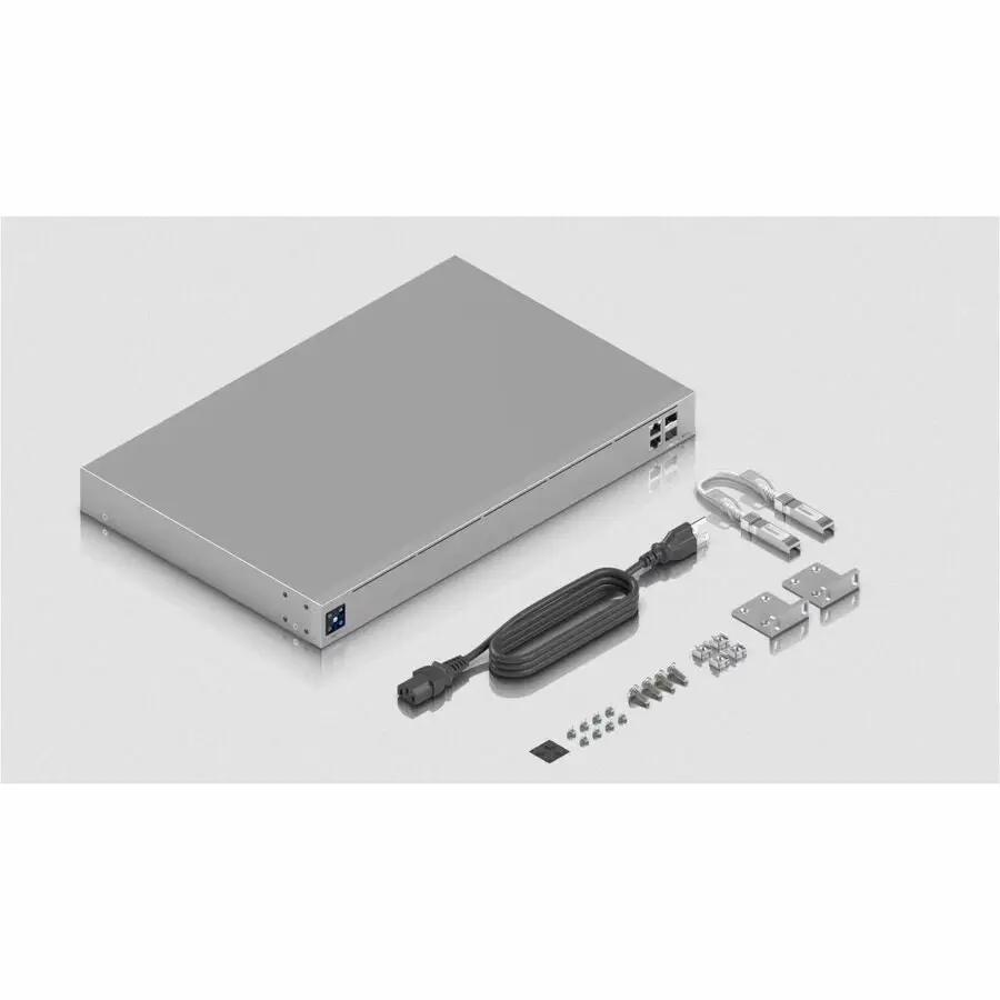 Ubiquiti UniFi UXG Pro 10GbE SFP+ Gateway; silver metal chassis with power cord and mounting brackets and screws