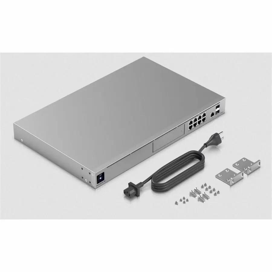 Ubiquiti UniFi UDM-SE 8-Port PoE+ Router with power cord, 2 mounting brackets, and screws