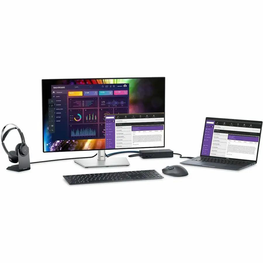 Dell UltraSharp U2724D 27-inch monitor with silver stand, paired with laptop, keyboard, mouse, dock, and headset