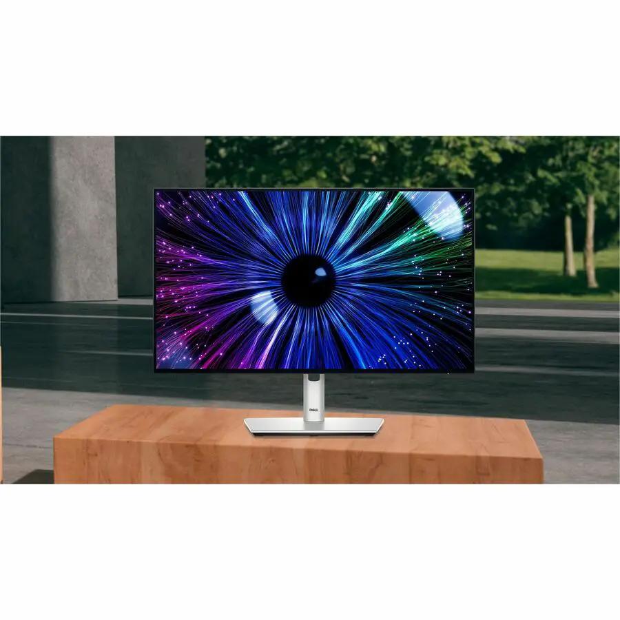 Dell UltraSharp U2424HE 24-inch FHD monitor with black bezel on a silver stand