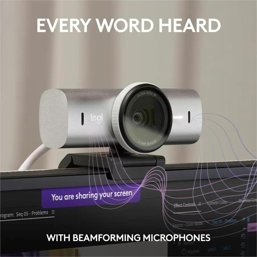 Logitech MX BRIO webcam on monitor; silver body with Logi logo