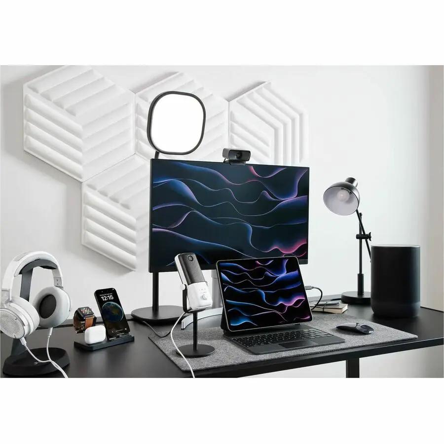 Elgato FaceCam MK.2 webcam, black, on a desk setup with monitor, laptop, mic, and ring light.