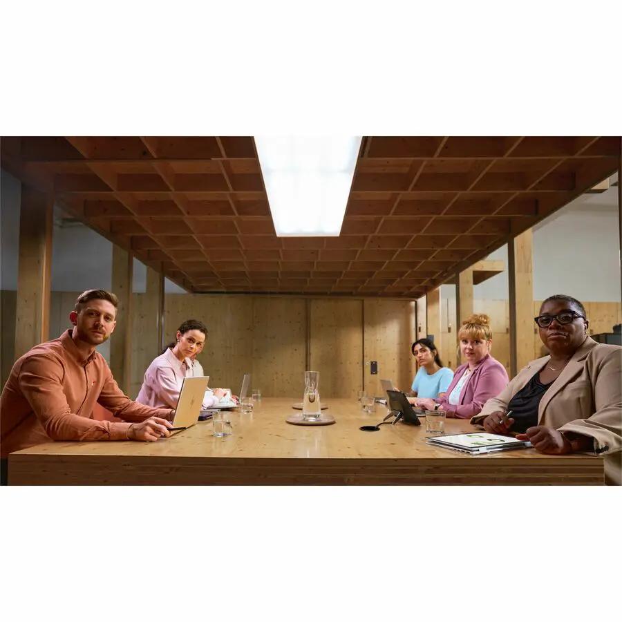 HP EliteBook 835 G11 notebook in use during a team meeting with five professionals around a wooden conference table