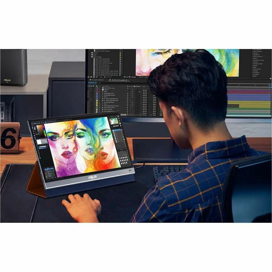 ASUS ZenScreen MQ16AHE 16-inch OLED portable monitor with silver frame on a stand, displaying colorful artwork.