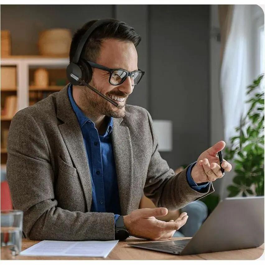 WH64 HYB DUAL STND MS headset with microphone, black, worn by man at laptop