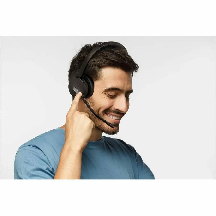 Yealink BH70 Dual UC USBC/A headset, black, worn by a man.