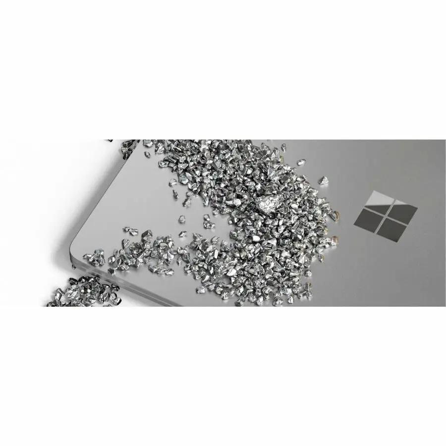 Microsoft Surface Laptop 7 platinum laptop with scattered crystal decorations on the lid