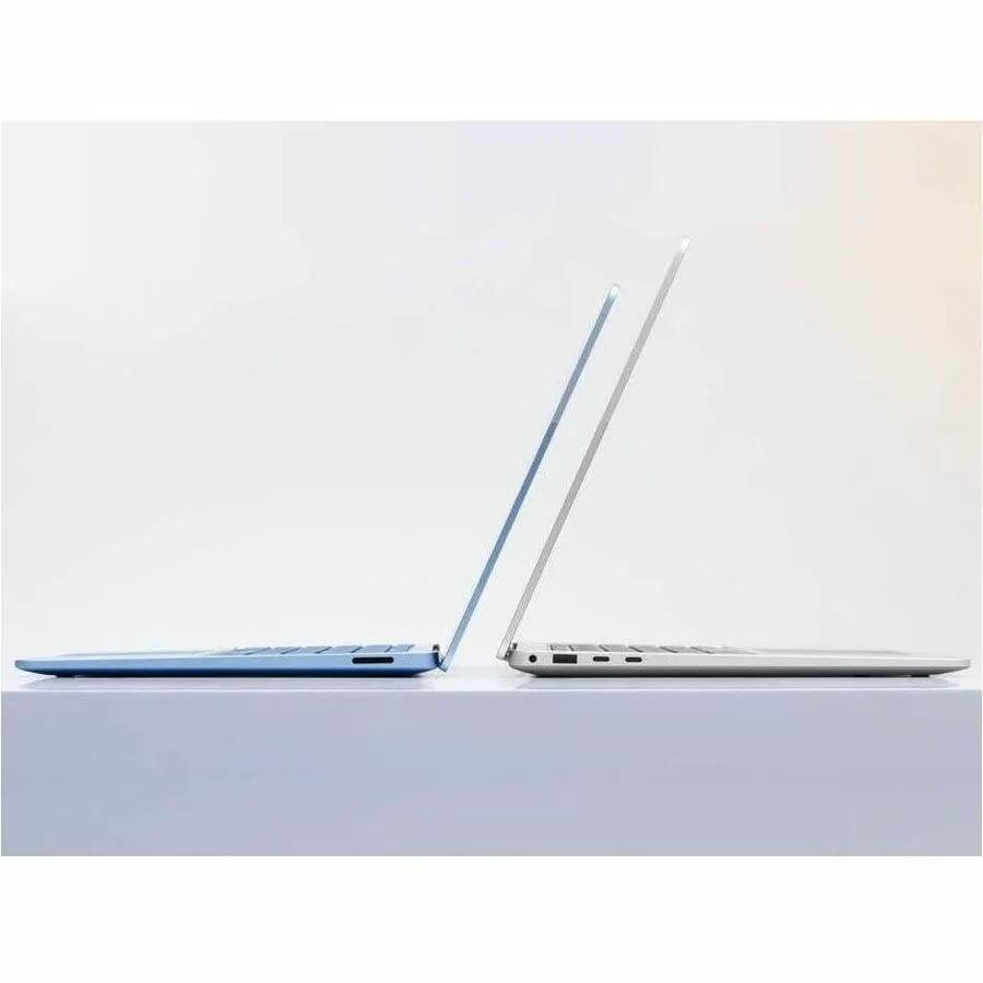 Microsoft Surface Laptop 7 blue and platinum laptops, two units displayed side by side.