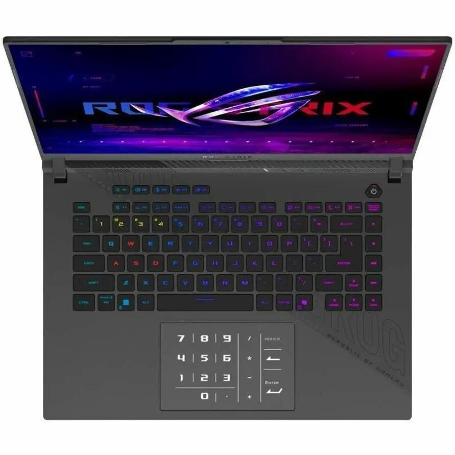 ASUS ROG Strix G16 gaming laptop, top-down view with RGB backlit keyboard, dark chassis and visible ROG logo on lid