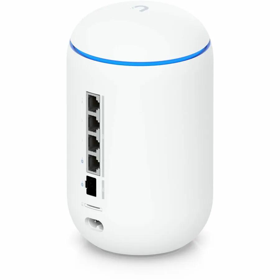 Ubiquiti UniFi Dream Router 7 white cylindrical wireless router with four PoE Ethernet ports and blue ring