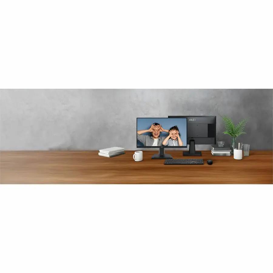 MSI Pro MP225 22-inch Full HD monitor, black, on a wooden desk