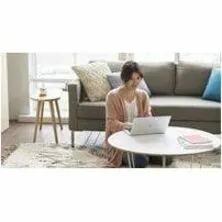 HP EliteBook 8 Laptop Glacier Silver on a round white coffee table in a living room