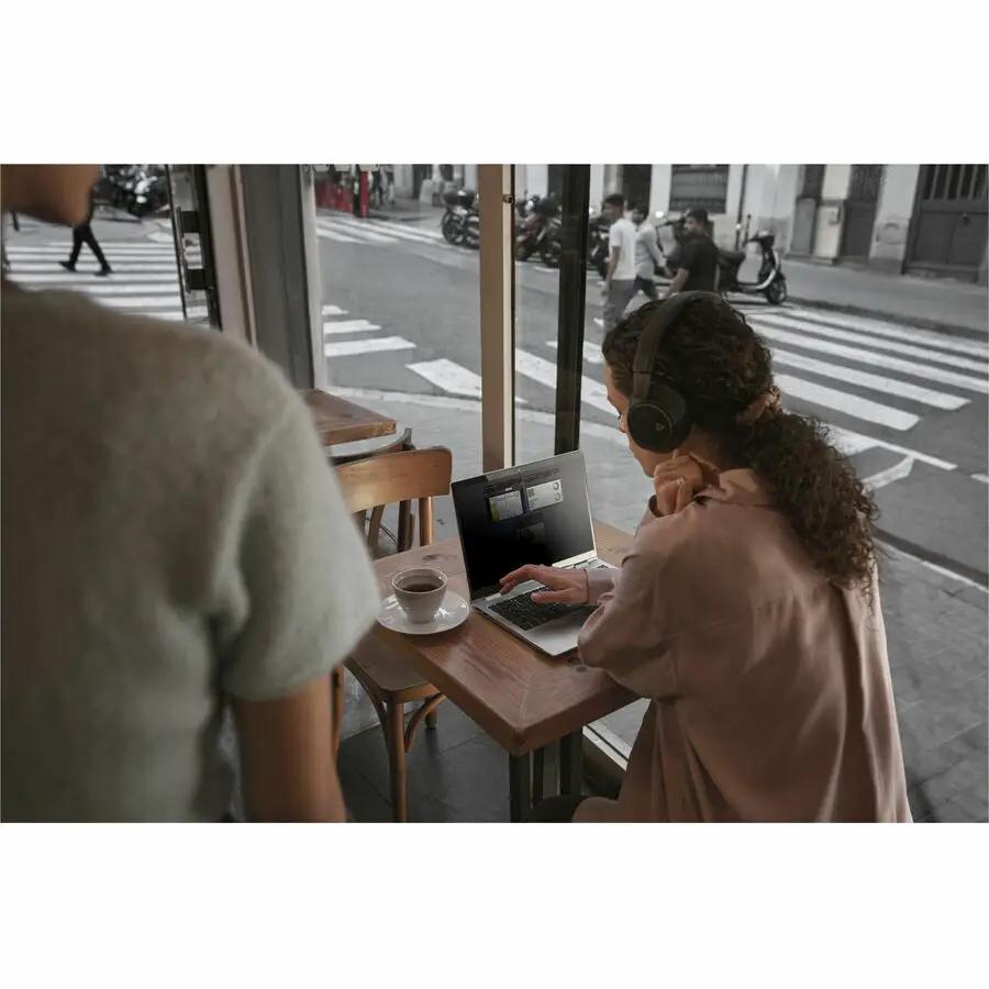 HP EliteBook 8 laptop in glacier silver with 32 GB RAM and 1 TB SSD on a cafe table
