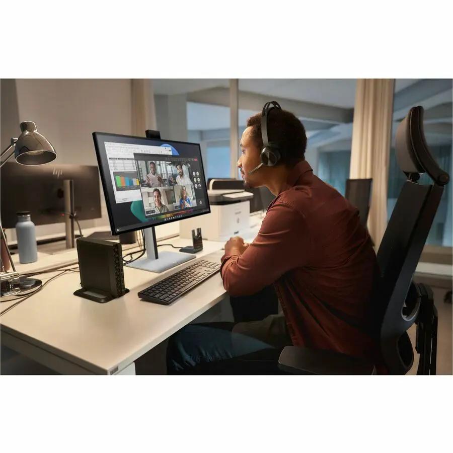 HP EliteDesk 8 Mini G1i Desktop PC, black, on an office desk with monitor and keyboard