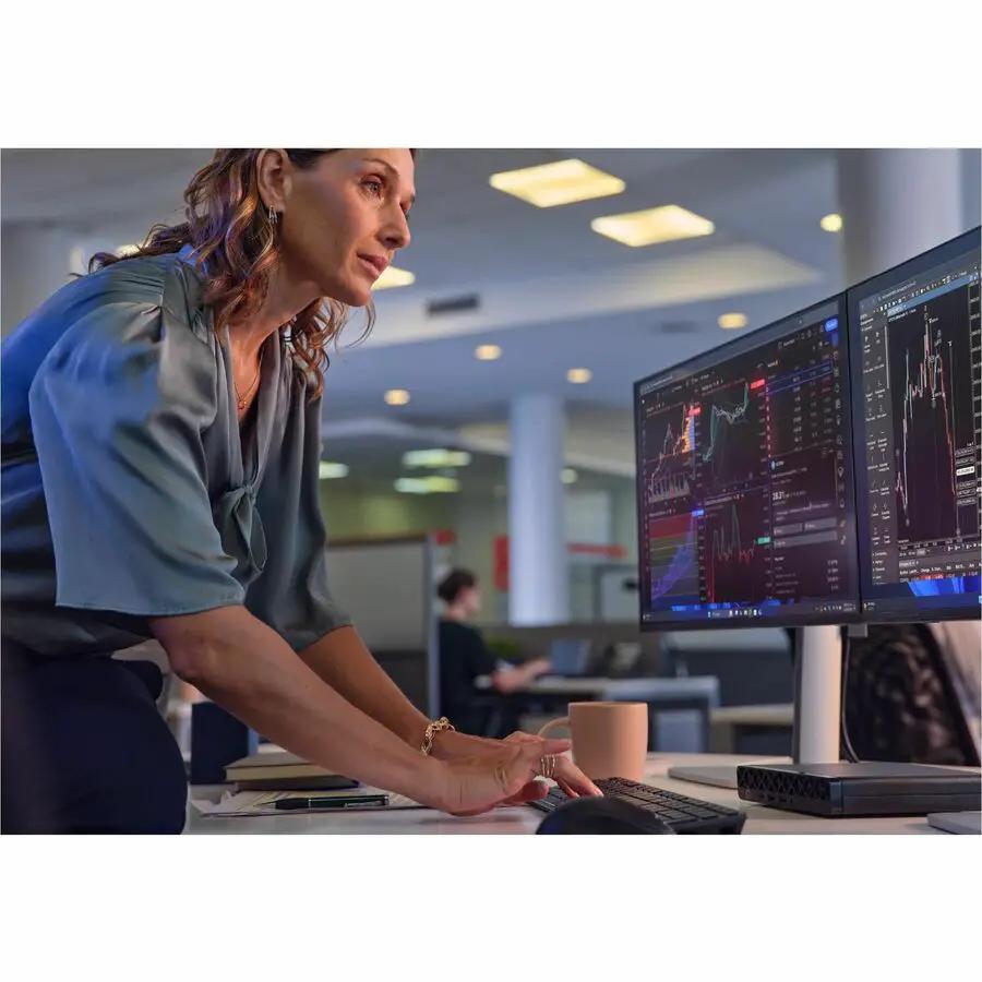 HP EliteDesk 8 Mini G1i desktop PC, black, on an office desk with dual monitors