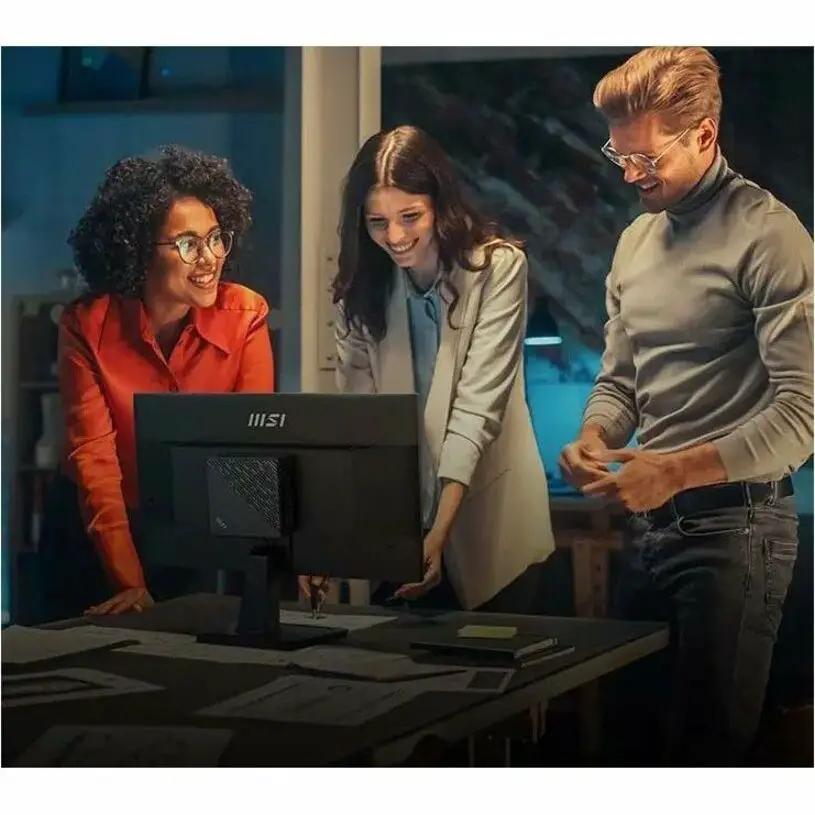 MSI PRO MP225V 21-inch Full HD monitor on desk; black with three colleagues gathered around.