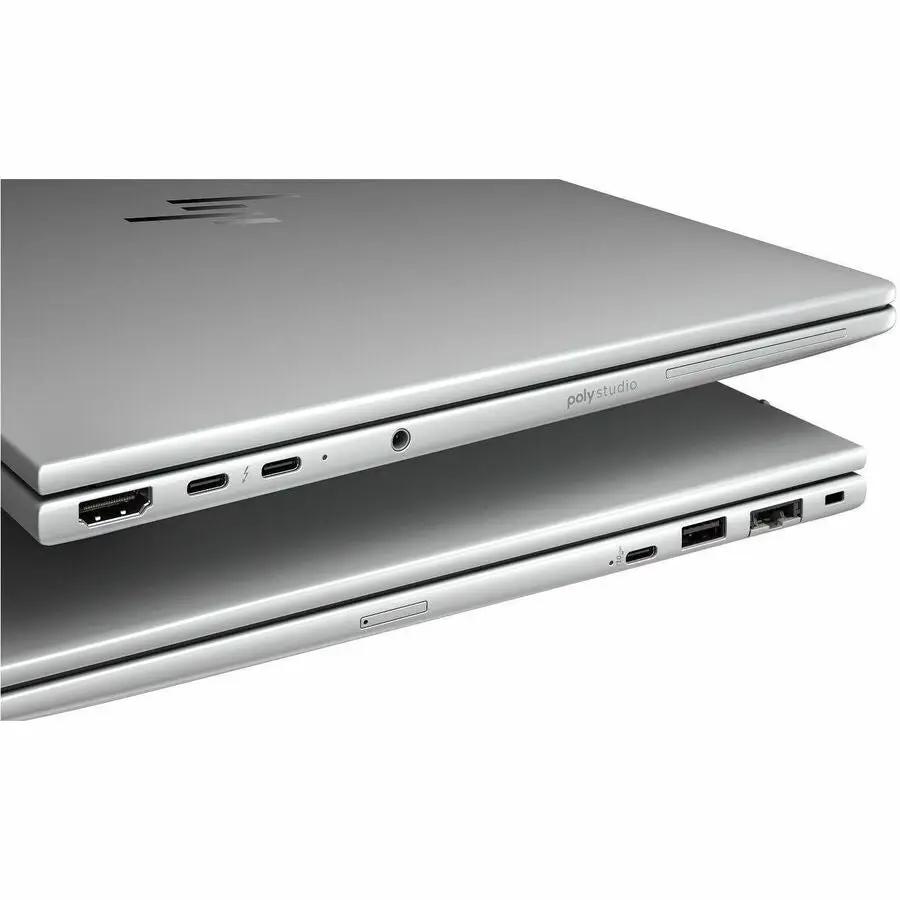 HP EliteBook 14 laptop in silver; two laptops stacked with visible side ports