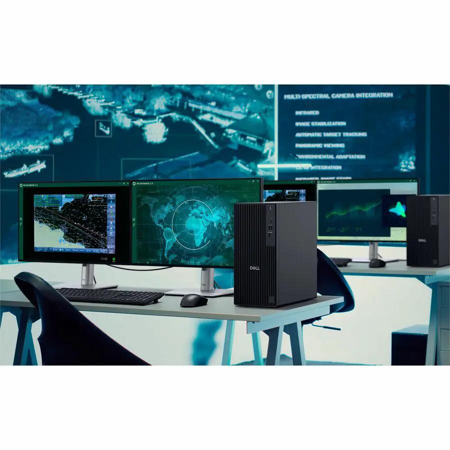 Dell QCT1250 Pro Tower desktop computer in black with three monitors on a lab desk.
