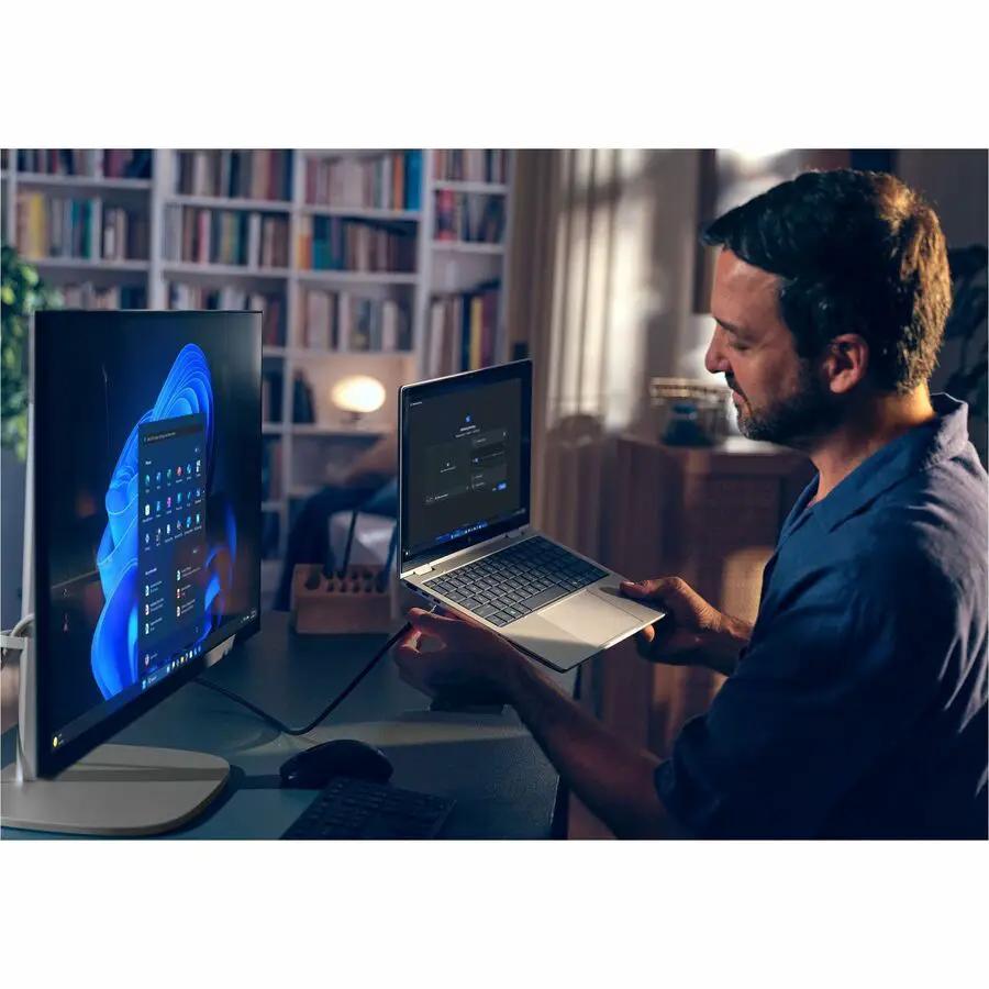HP EliteStudio G1i All-in-One AI-powered desktop setup with external monitor and laptop